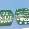 A set of green and white plastic keychains with laser-etched weed quotes, including “99 Problems & 420 Solutions” and “I Just Need More Weed.” These can also be used as magnets.