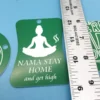 A collection of green and white plastic keychains with cannabis-themed phrase