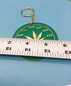Cool Leaf Character Rearview/Keychain Charm – Mellow Gold Accent on Forest Green showing ruler for size