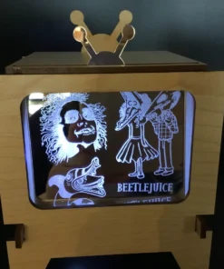 Laser-engraved themed acrylic insert glowing inside vintage-style TV frame