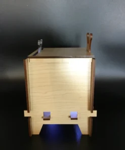 Side view of wooden retro TV box showing glowing light from vent slats.