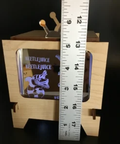 Measuring height of custom lightbox display with ruler.