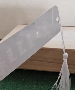 Glossy back of engraved bookmark with white tassel