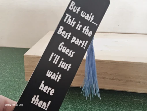 Black inspirational bookmark with blue tassel – “But wait… this is the best part!”