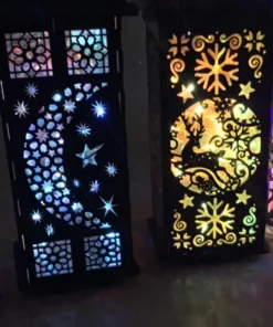 Colorful LED lanterns with intricate cutout designs – sugar skull, crescent moon, reindeer, and Eiffel Tower.