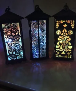 Wooden lanterns with sugar skull, floral lattice, and Christmas tree cutouts