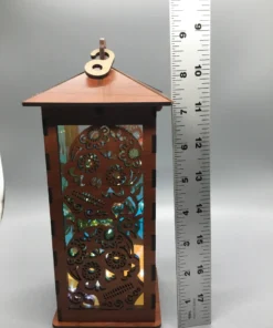 arge sugar skull wooden lantern with LED lights, shown next to a 12-inch ruler for scale.