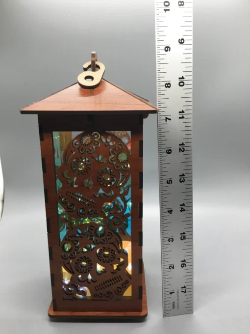arge sugar skull wooden lantern with LED lights, shown next to a 12-inch ruler for scale.
